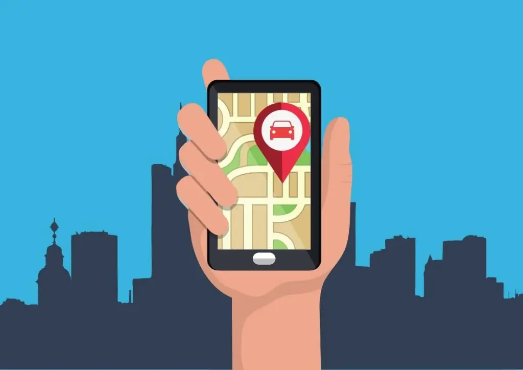 Mão segurando um celular aberto em um aplicativo de transporte,. Ao fundo vemos a paisagem de uma cidade.