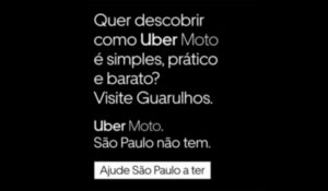 Imagem com fundo preto e texto branco promovendo o serviço Uber Moto em Guarulhos. A mensagem destaca que São Paulo não tem o serviço e incentiva os usuários a apoiarem sua implementação na cidade.