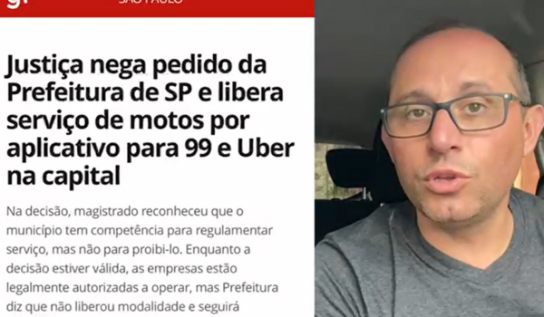 Imagem de um homem falando em frente à câmera, com um fundo desfocado de um carro. Ele está comentando sobre uma notícia que fala sobre a decisão judicial que libera o serviço de motos por aplicativos 99 e Uber na cidade de São Paulo. O título da notícia está visível ao lado dele, mencionando a decisão da Justiça que negou o pedido da Prefeitura de SP para proibir esse serviço.
